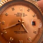 gold Datejust watch with diamond-set bezel and dial