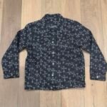 Black denim jacket with cross pattern